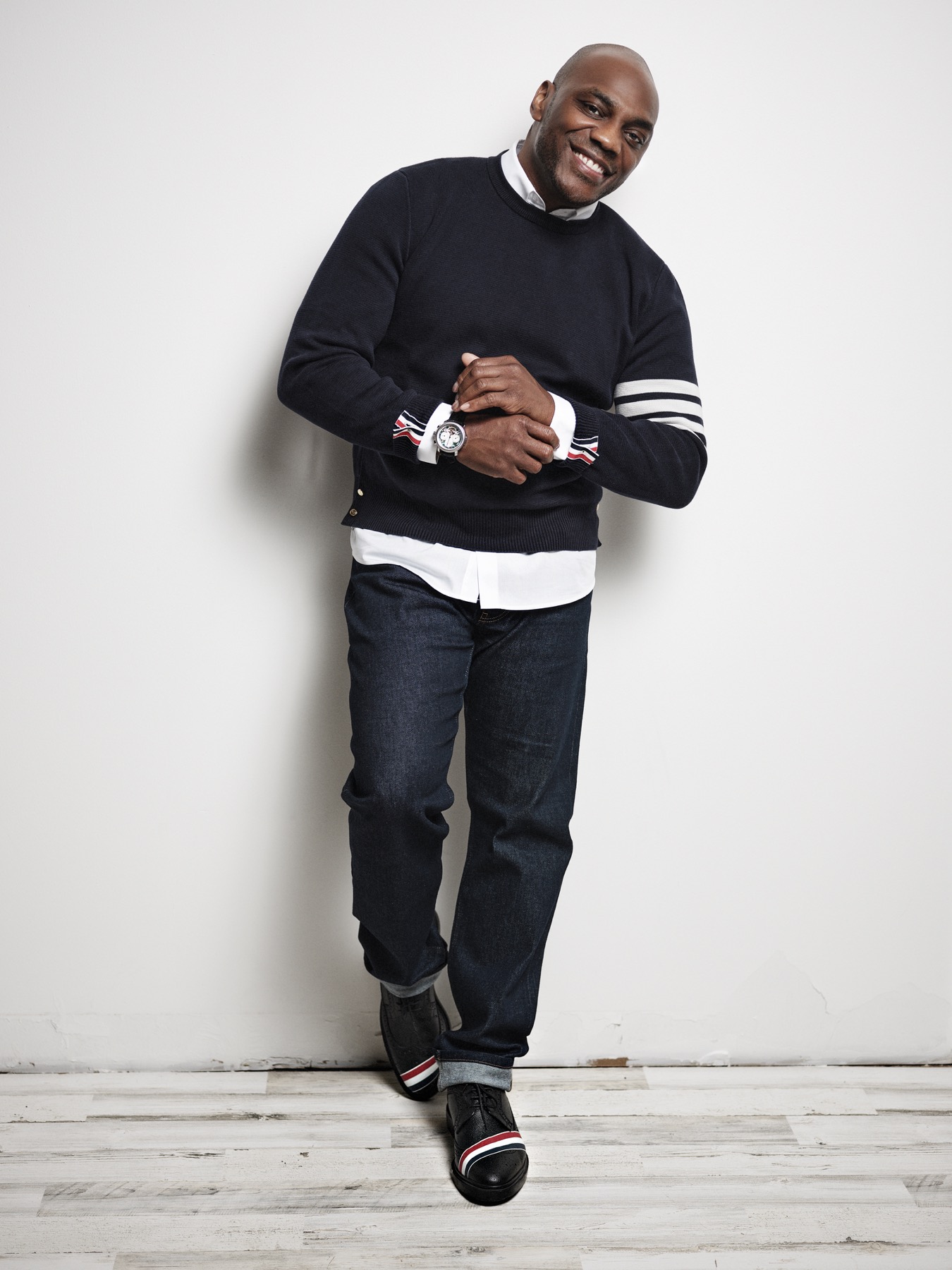 Tello standing in a full-body studio portrait